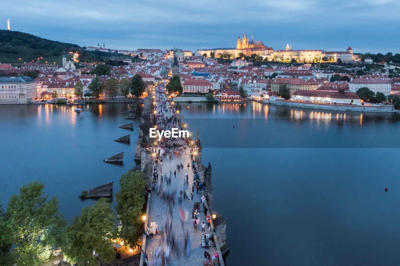 High angle view of illuminated bridge over river in city