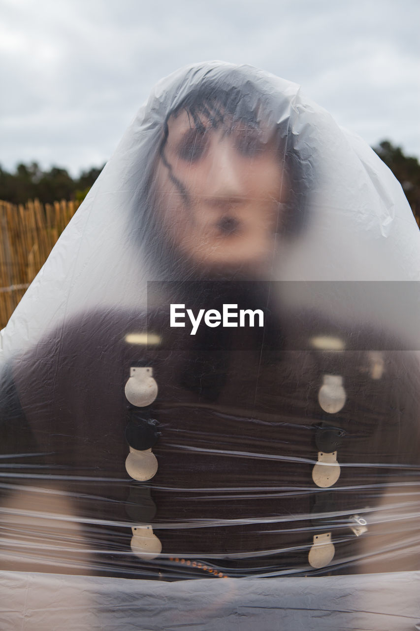 Sculpture covered with plastic against sky