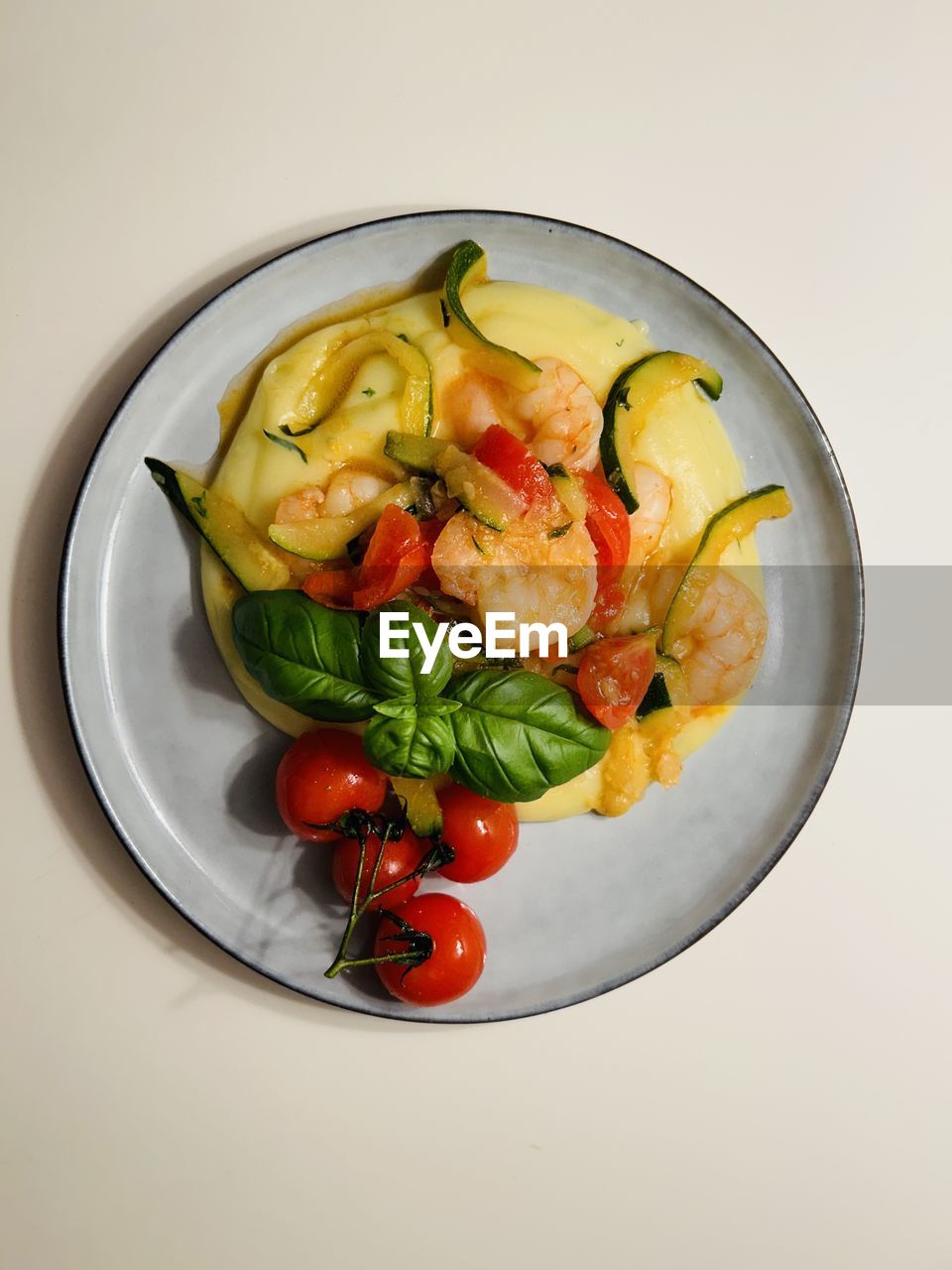 food and drink, food, healthy eating, vegetable, wellbeing, freshness, fruit, studio shot, dish, indoors, tomato, directly above, salad, produce, plate, high angle view, no people, meal, green, cherry tomato, bowl, cuisine, still life, seafood, organic