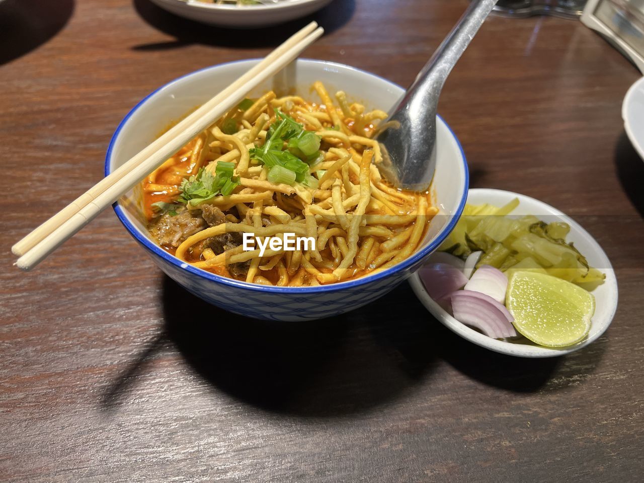 food and drink, food, pasta, italian food, healthy eating, bowl, table, dish, wellbeing, noodle, freshness, cuisine, indoors, kitchen utensil, no people, asian food, meal, vegetable, eating utensil, high angle view, wood, chopsticks, plate, spoon, crockery, lunch, still life, household equipment
