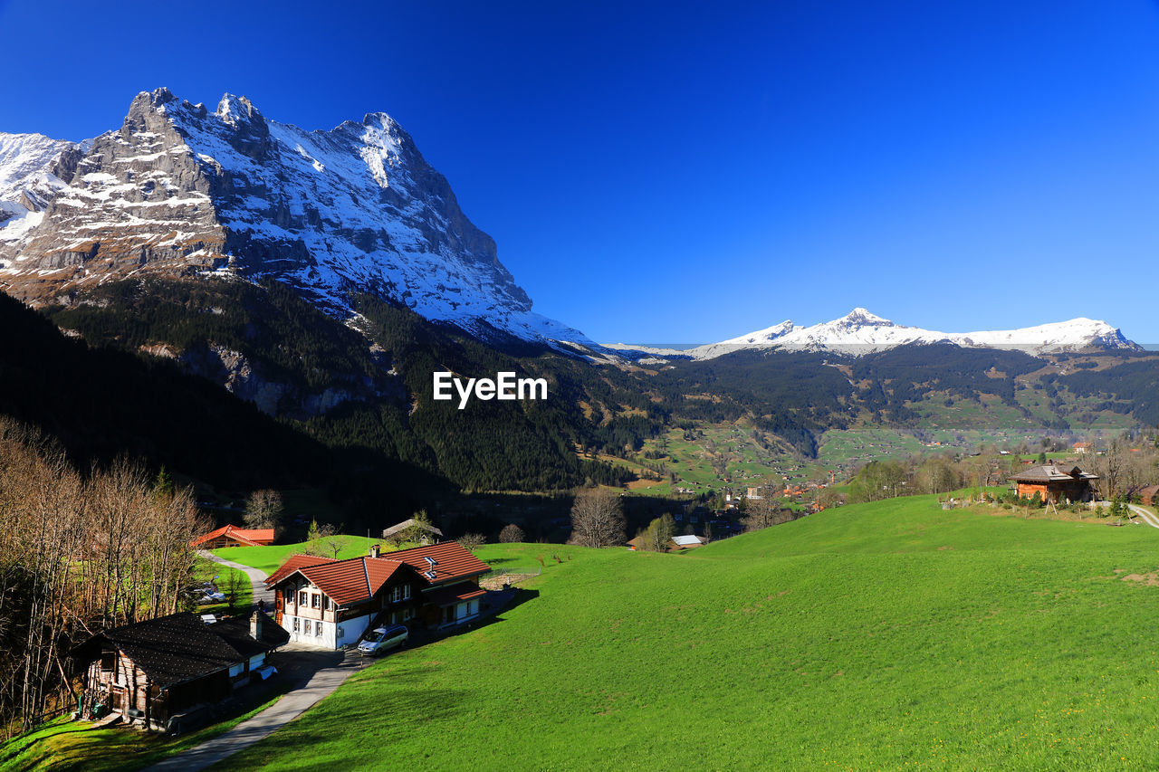 SCENIC VIEW OF MOUNTAINS AGAINST CLEAR SKY