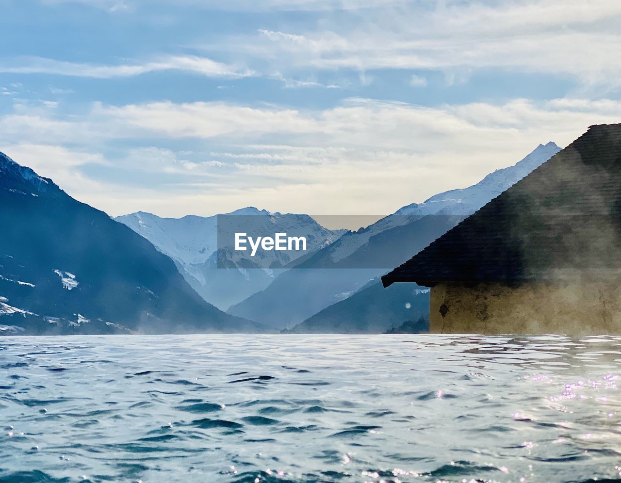 Scenic view of snowcapped mountains against sky