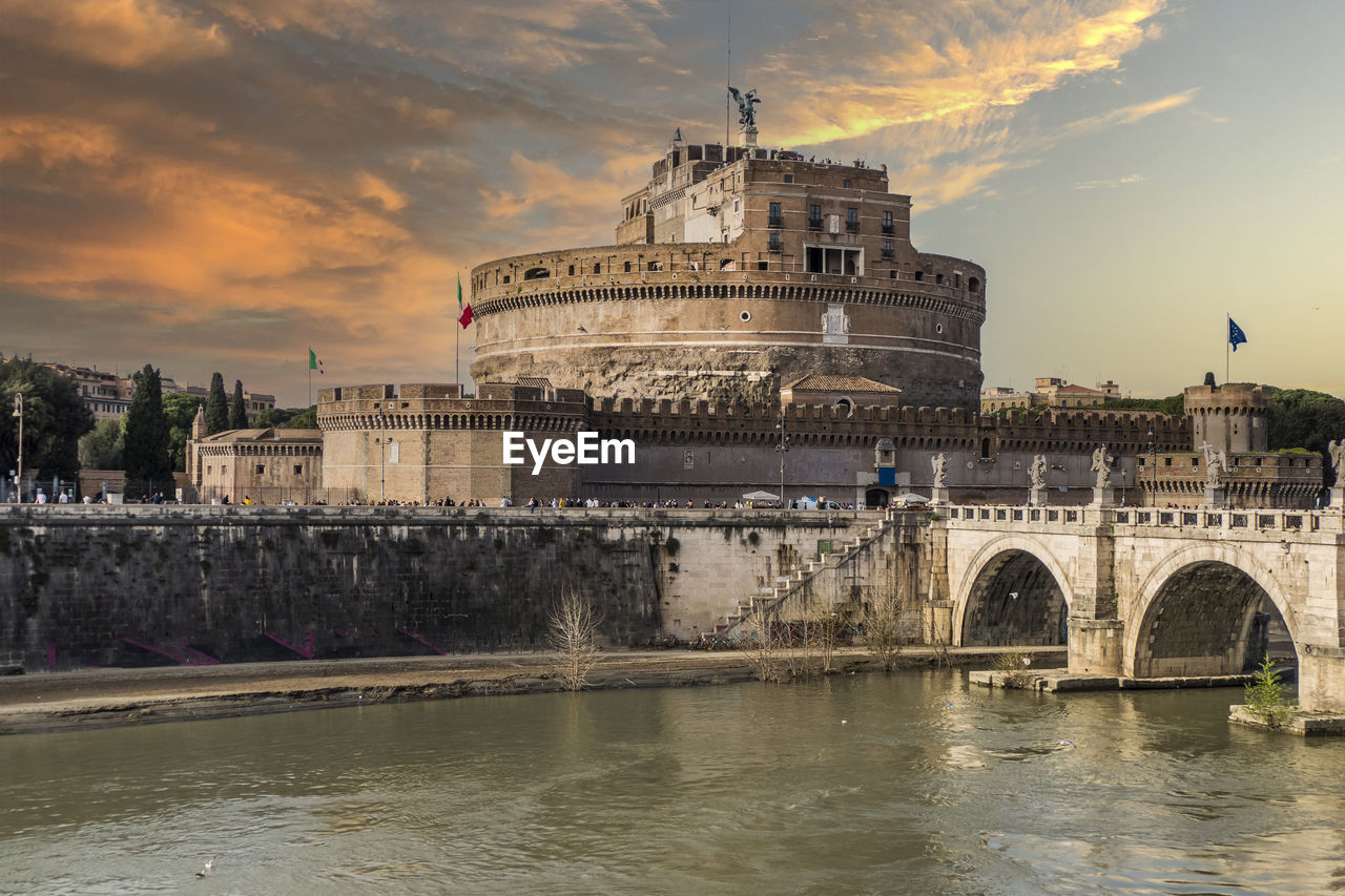 Tevere river and castle sant'angelo in rome at sunset