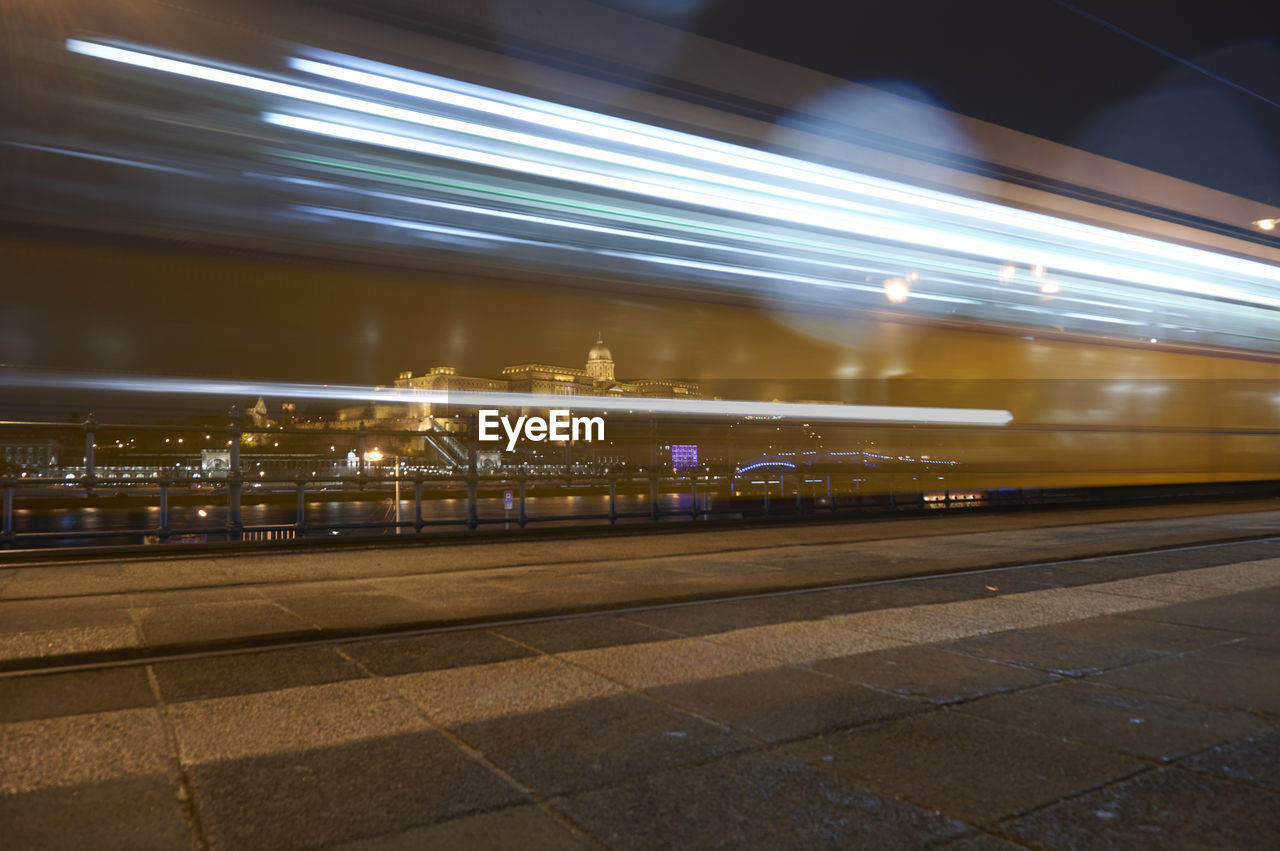 Long exposure of budapest castle and tram