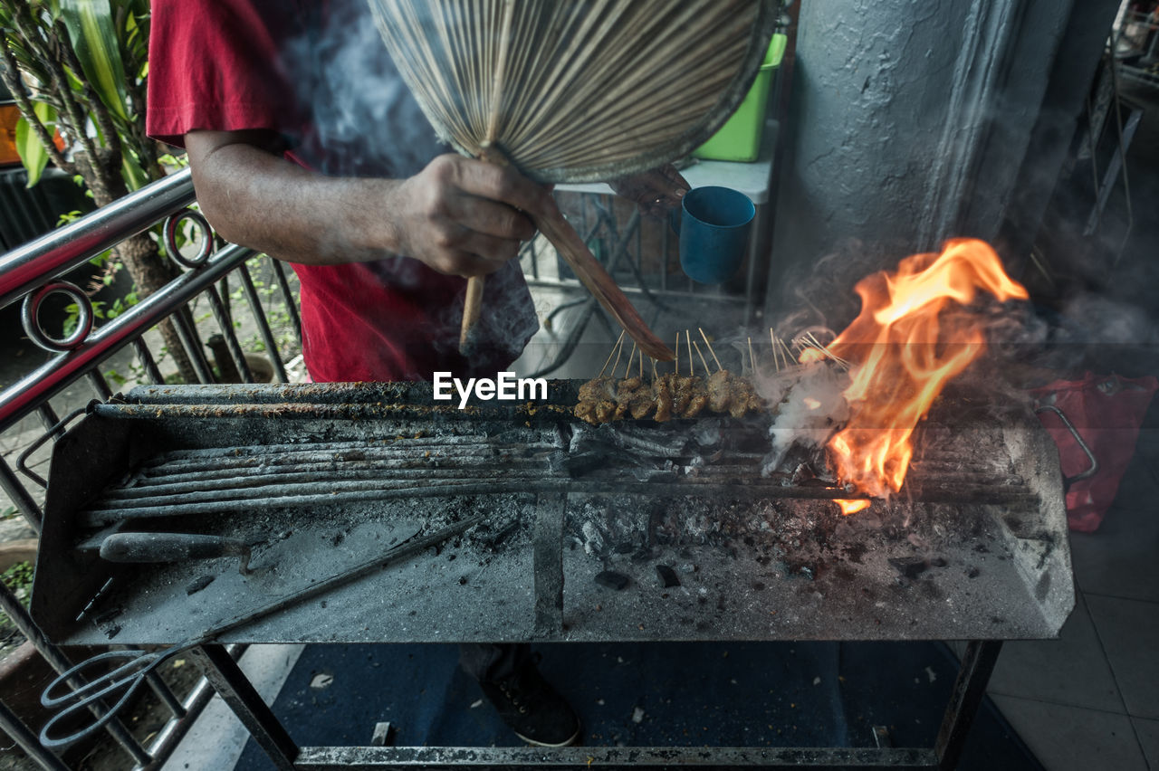 Close-up of man preparing food