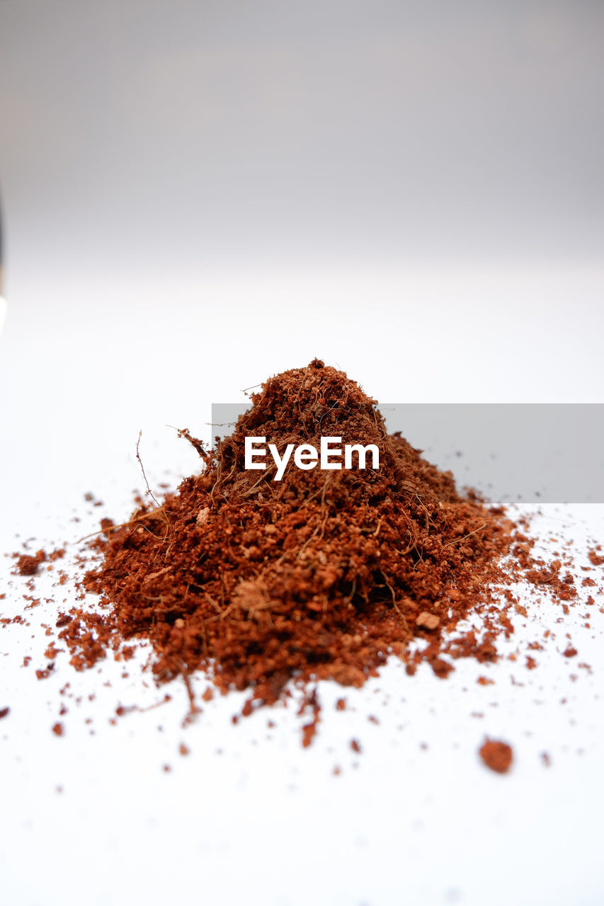 Close-up of cocopeat on white background