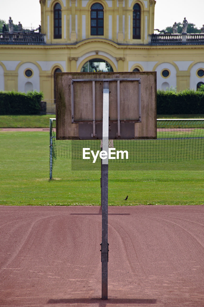 Playing field against historic building