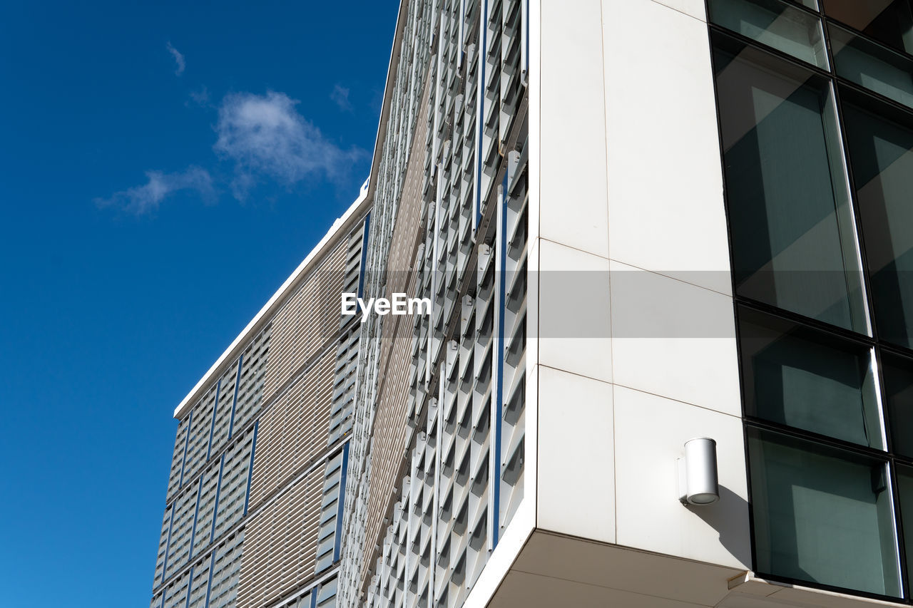 Low angle view of modern building against sky