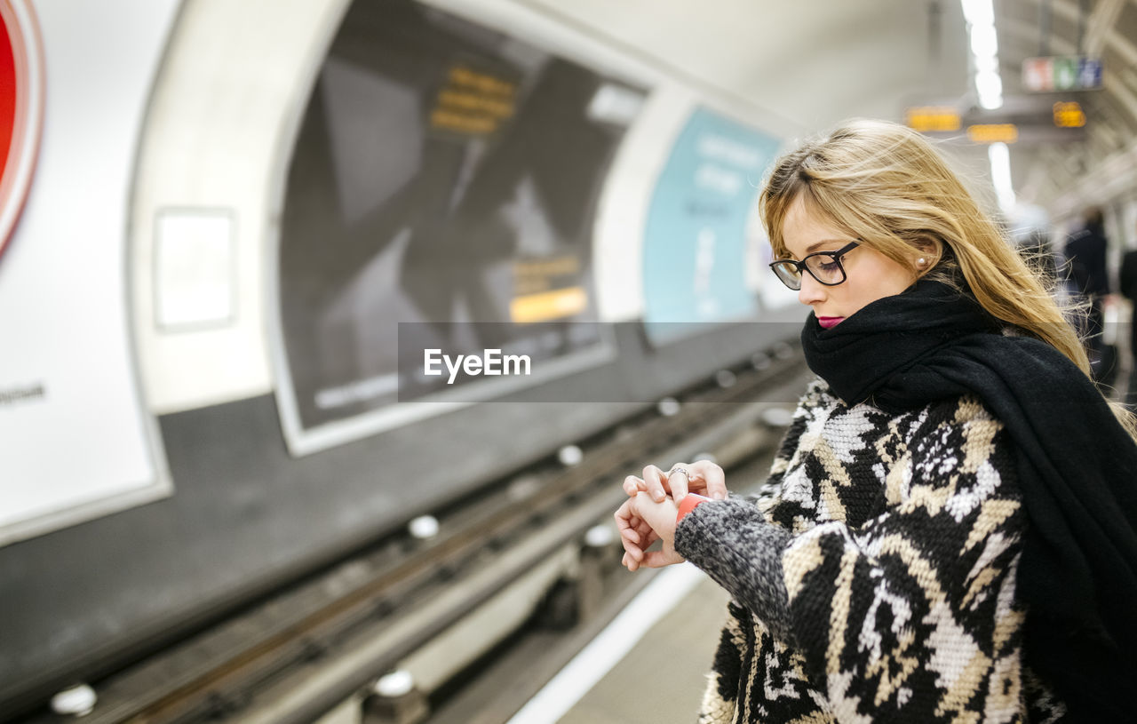 Young woman waiting for the subway