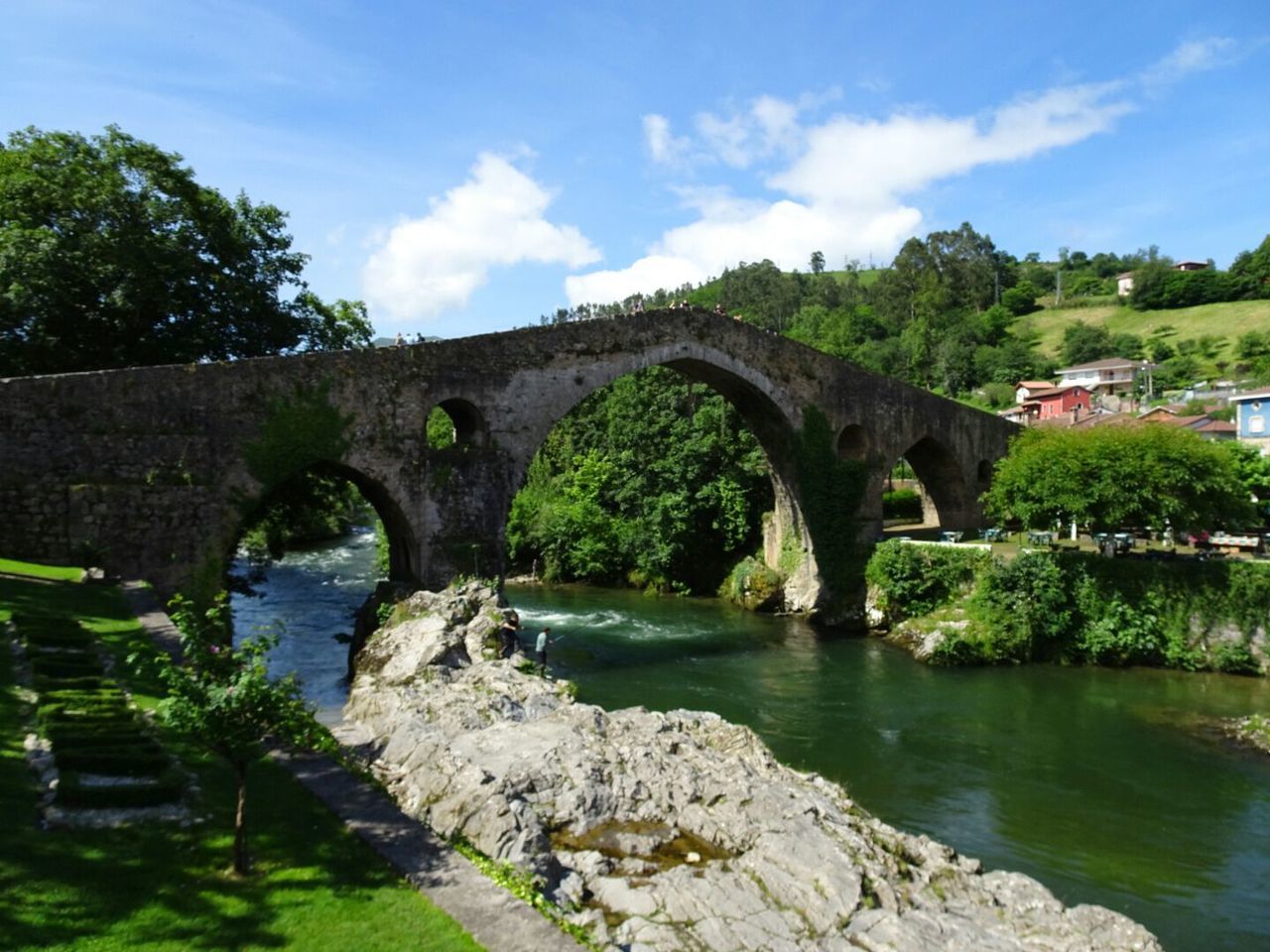 FOOTBRIDGE OVER RIVER WITH BRIDGE IN BACKGROUND