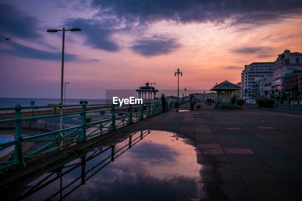 View of bridge over sea against cloudy sky