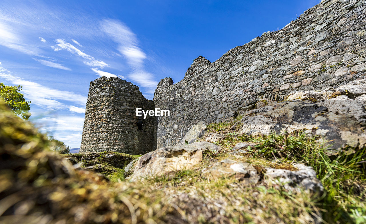 Low angle view of old ruins against sky