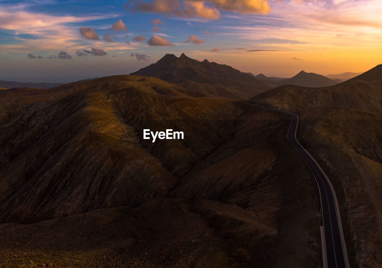 Scenic view of mountains against sky during sunset