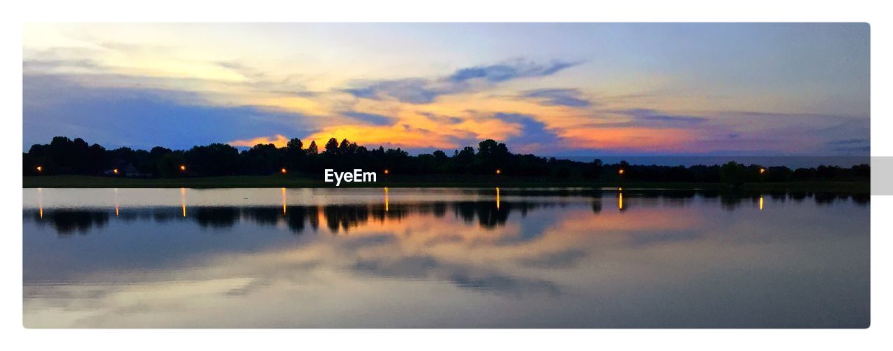 SCENIC VIEW OF LAKE AT SUNSET