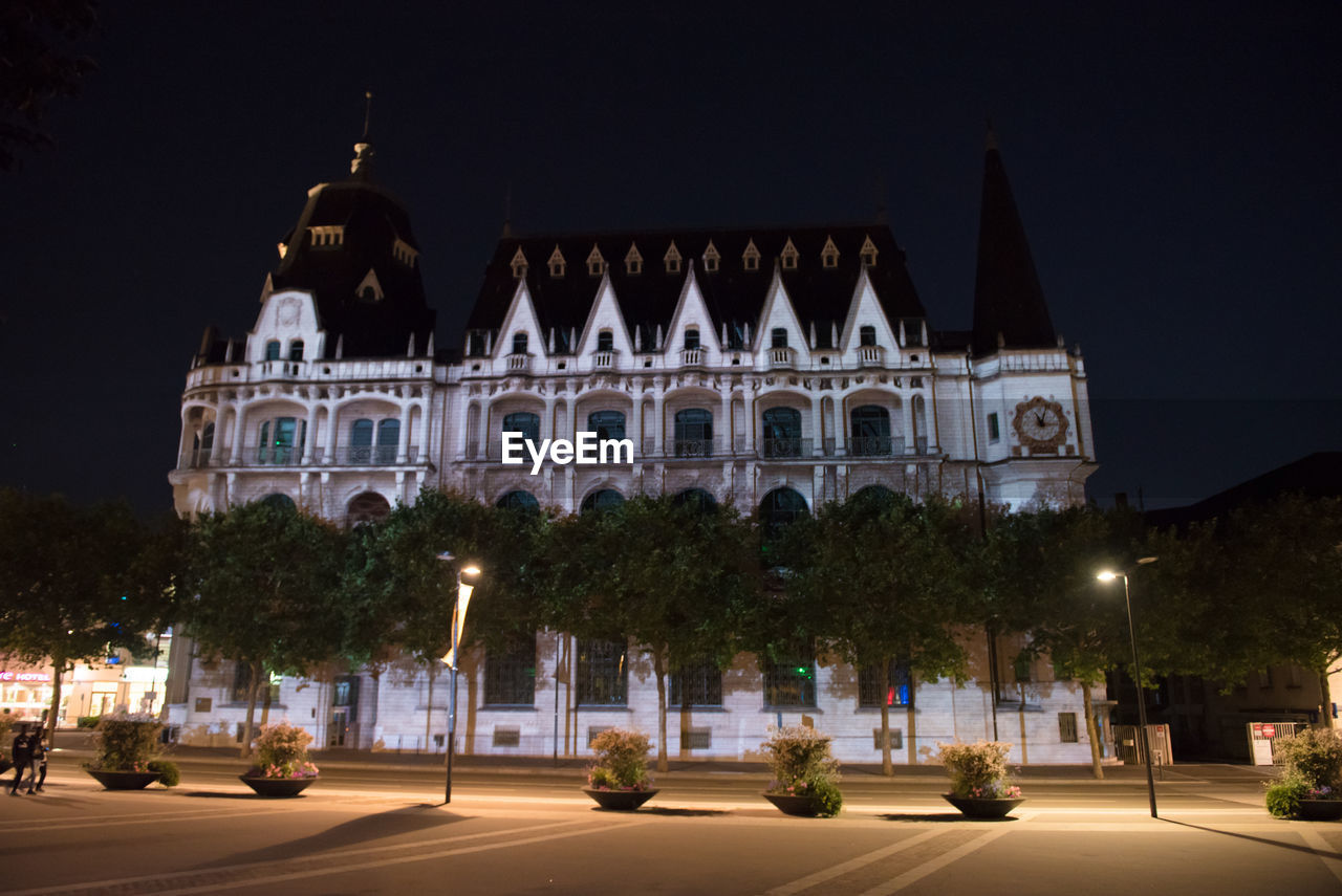 VIEW OF BUILDING AT NIGHT