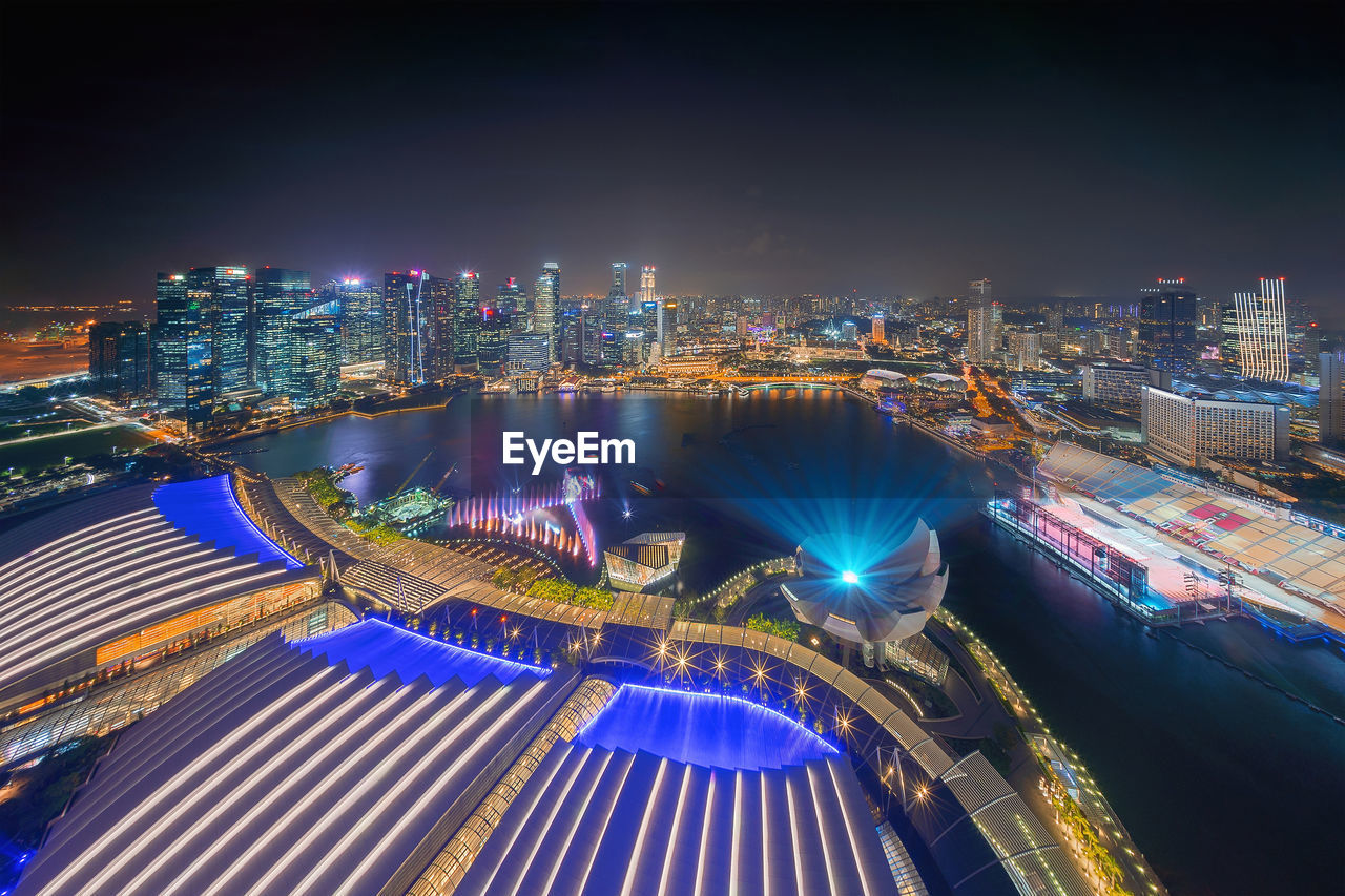 High angle view of illuminated cityscape at night