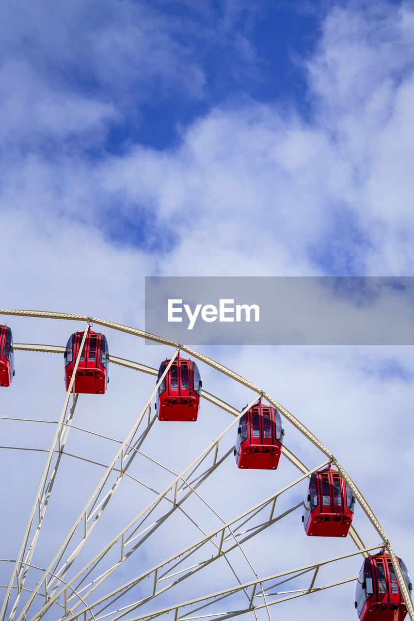 LOW ANGLE VIEW OF ROLLERCOASTER AGAINST SKY