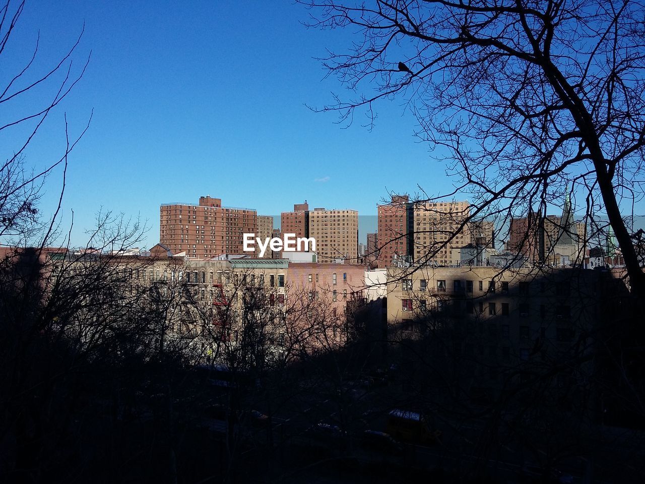 BUILDINGS IN CITY AGAINST SKY