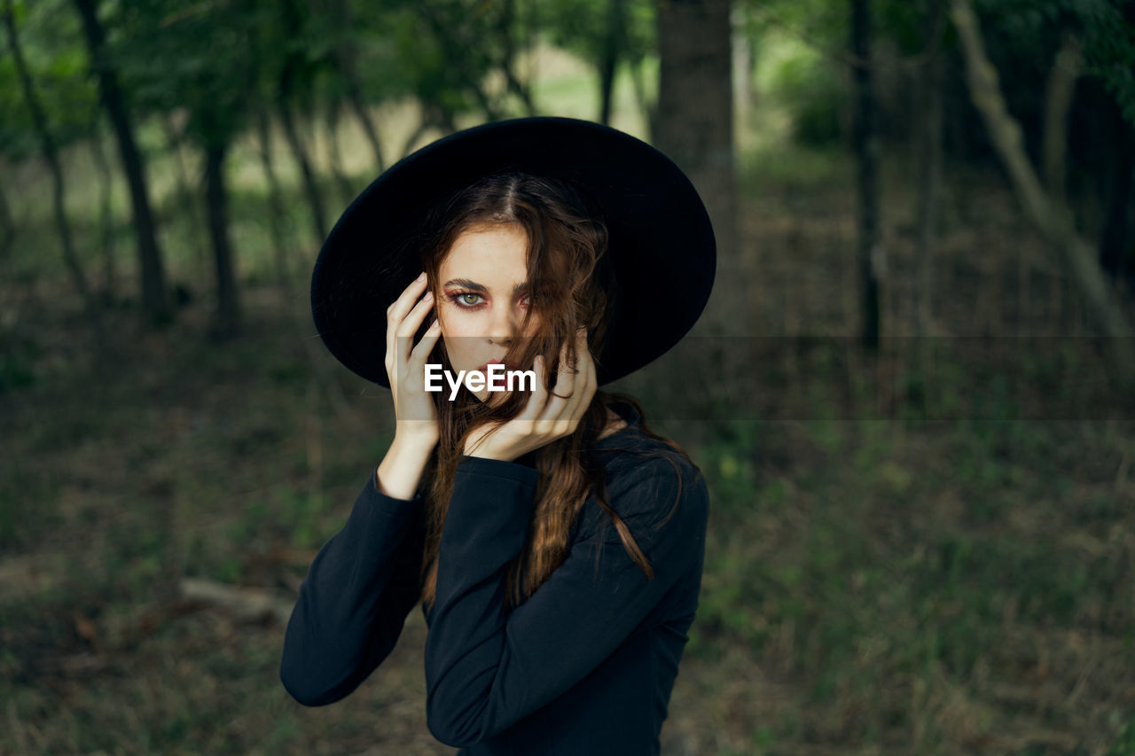 young woman wearing hat