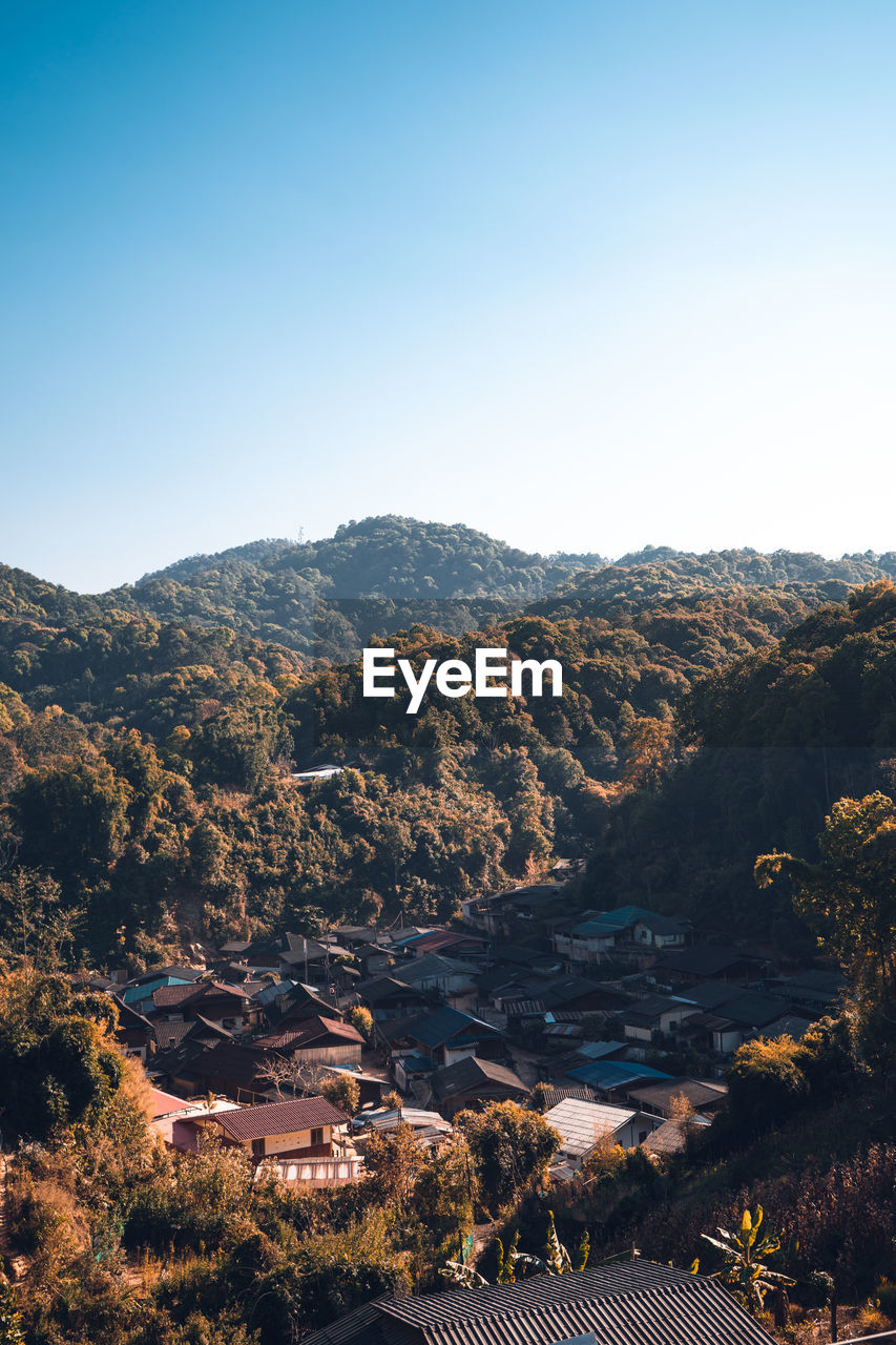 Scenic view of mountains against clear blue sky