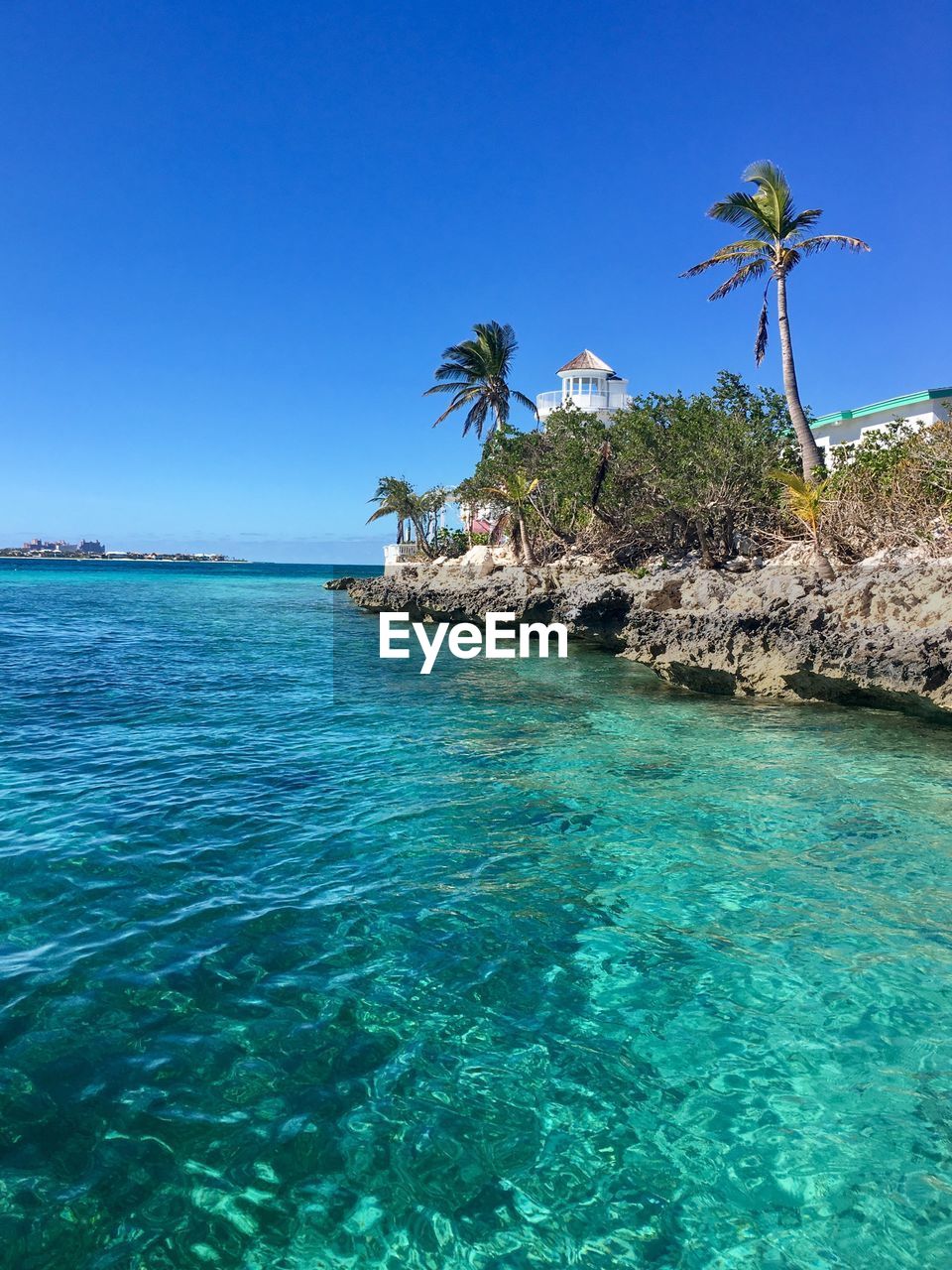 Scenic view of sea against clear blue sky