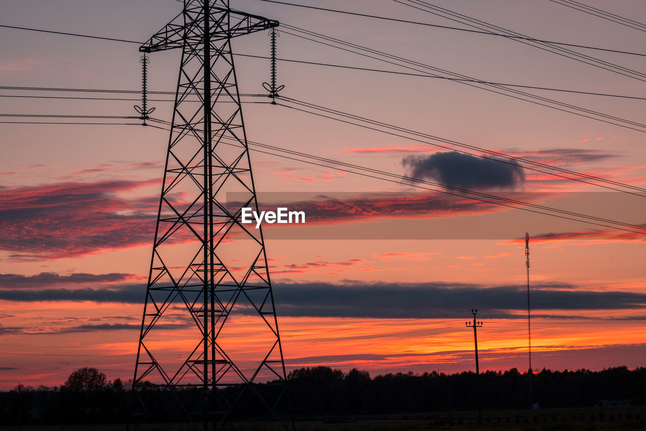 SILHOUETTE ELECTRICITY PYLON AGAINST SKY DURING SUNSET