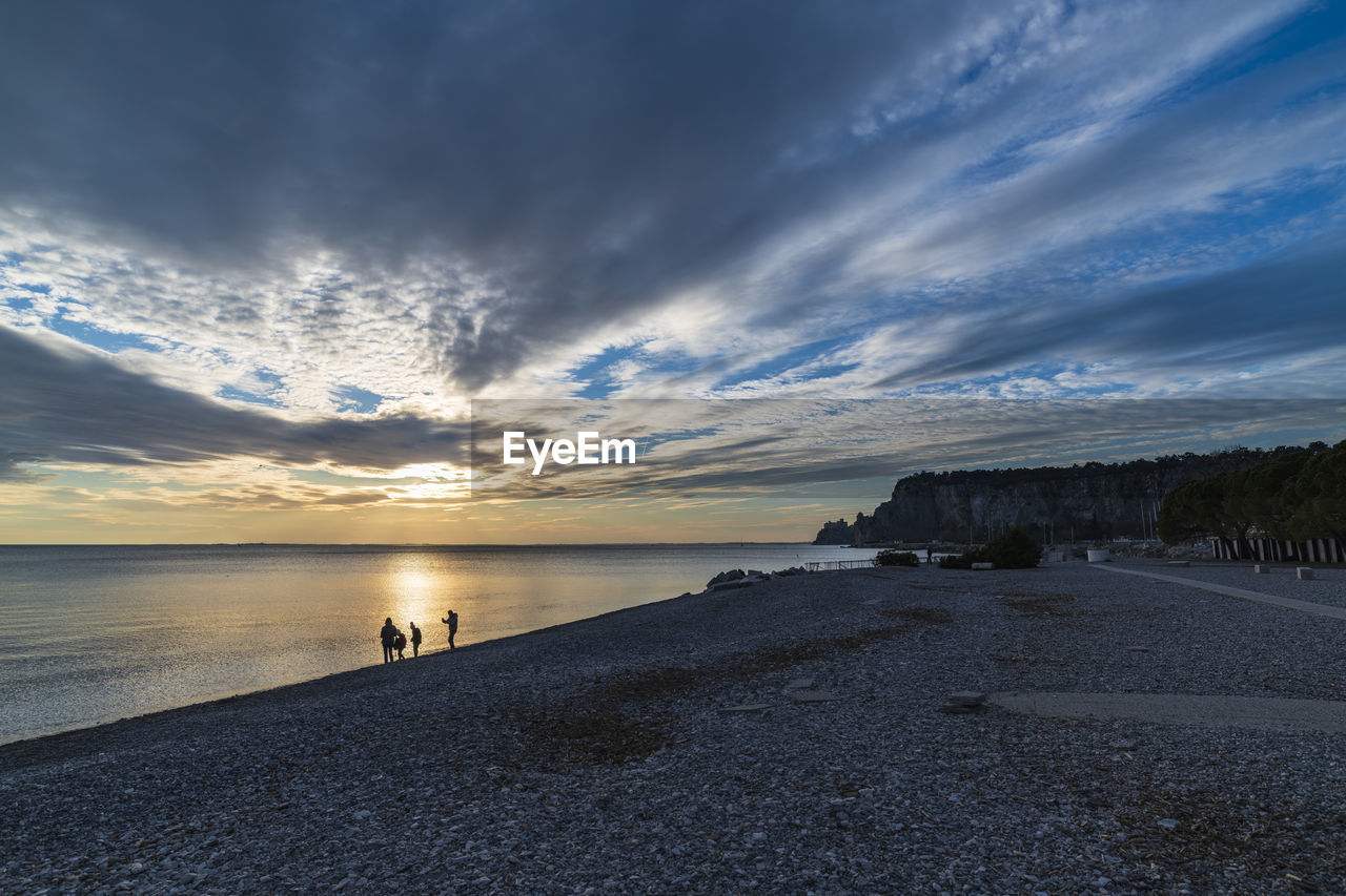 Winter sunset over the bay of portopiccolo sistiana. duino. italy