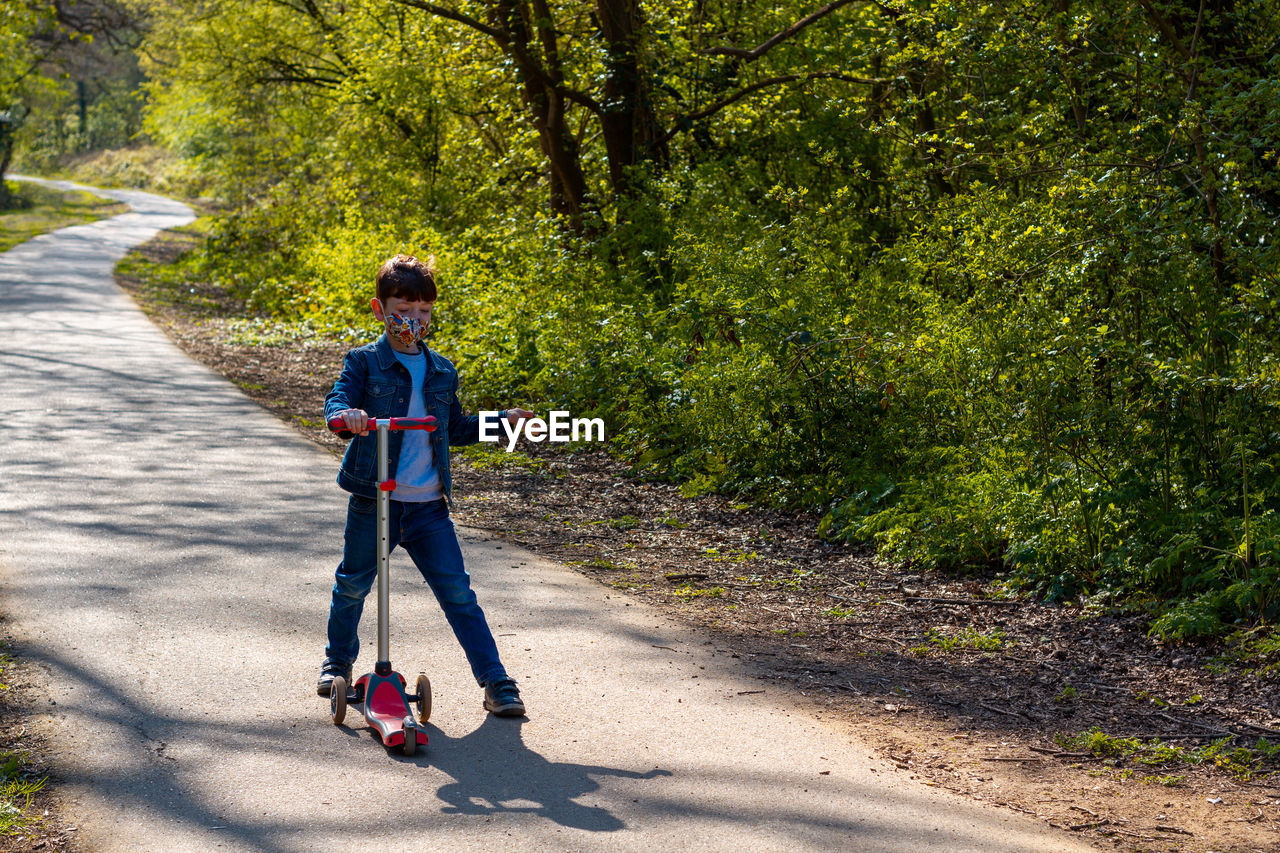 FULL LENGTH OF A BOY ON ROAD