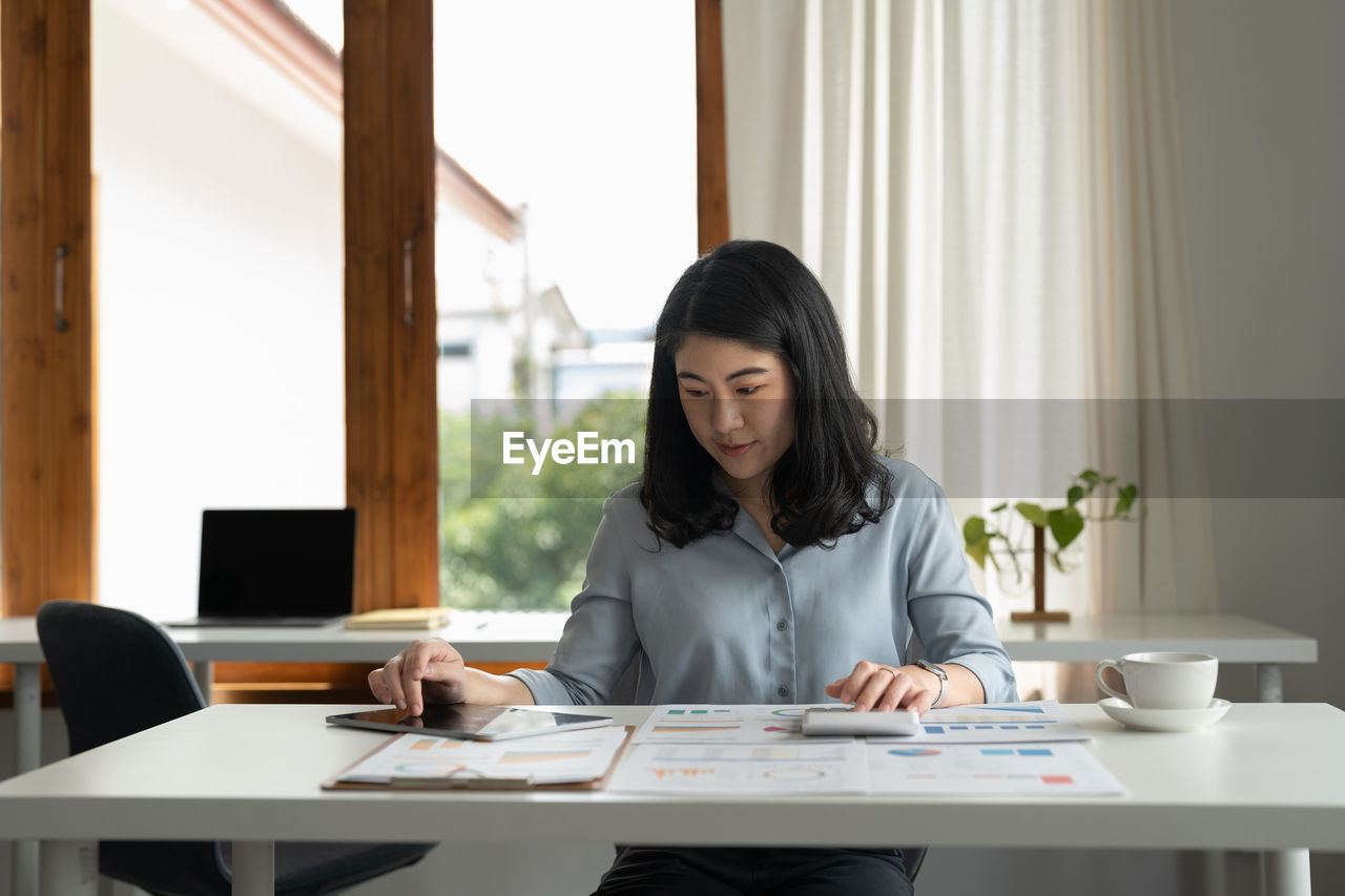 young businesswoman working at desk