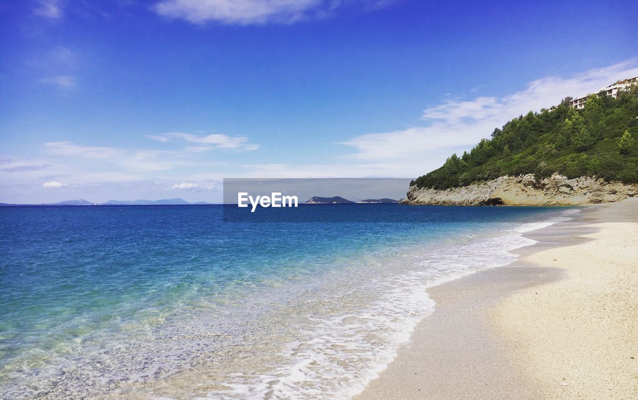 Scenic view of sea against blue sky