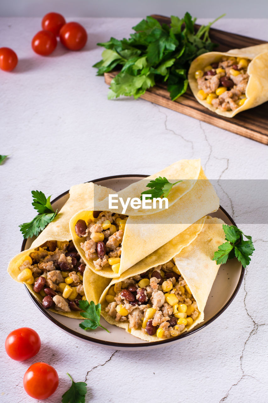 food and drink, food, healthy eating, vegetable, taco, dish, fast food, fruit, freshness, tomato, wellbeing, cuisine, meal, produce, studio shot, no people, herb, vegetarian food, plate, indoors, italian food, breakfast, tortilla, salad, meat, green, high angle view, appetizer