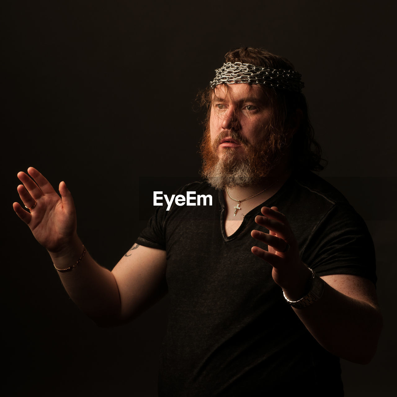 PORTRAIT OF MAN WEARING HAT AGAINST BLACK BACKGROUND