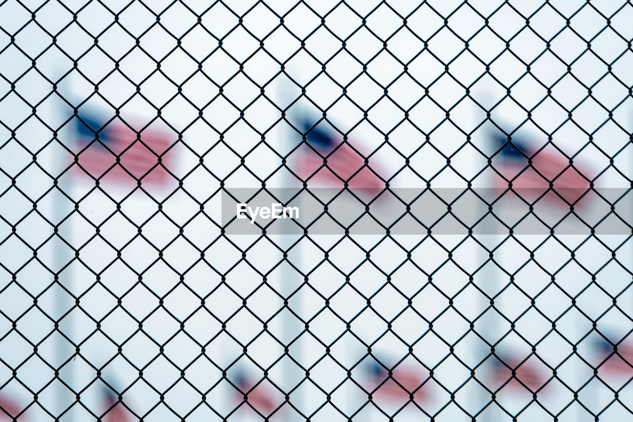 LOW ANGLE VIEW OF HEART SHAPE CHAINLINK FENCE