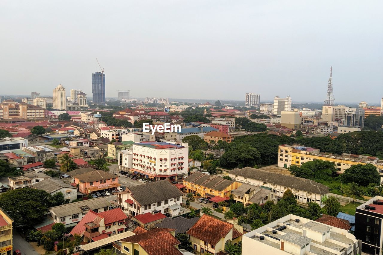architecture, city, building exterior, built structure, building, cityscape, skyline, urban area, metropolitan area, town, neighbourhood, aerial photography, high angle view, downtown, metropolis, bird's-eye view, residential district, residential area, sky, office building exterior, urban skyline, landscape, skyscraper, nature, city life, crowd, tower, travel destinations, suburb, roof, crowded, tower block, street, landmark, outdoors, horizon, downtown district, day, city street, travel, development