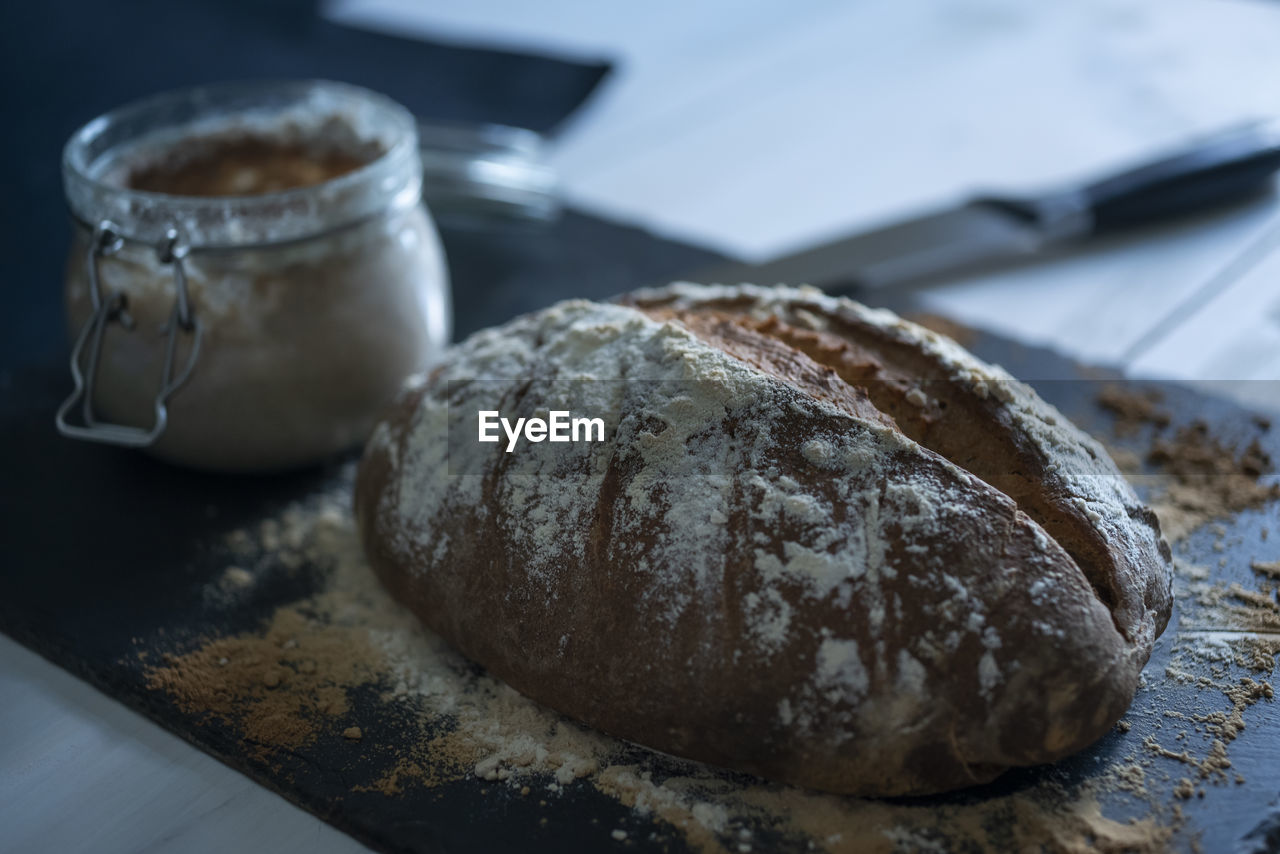 High angle view of homemade rustic bread on table.