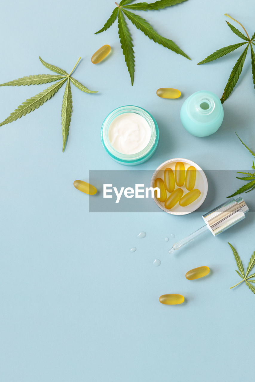 Herbal alternative medicine concept, cosmetics cbd oil. cannabis leaf skincare cosmetic product. 