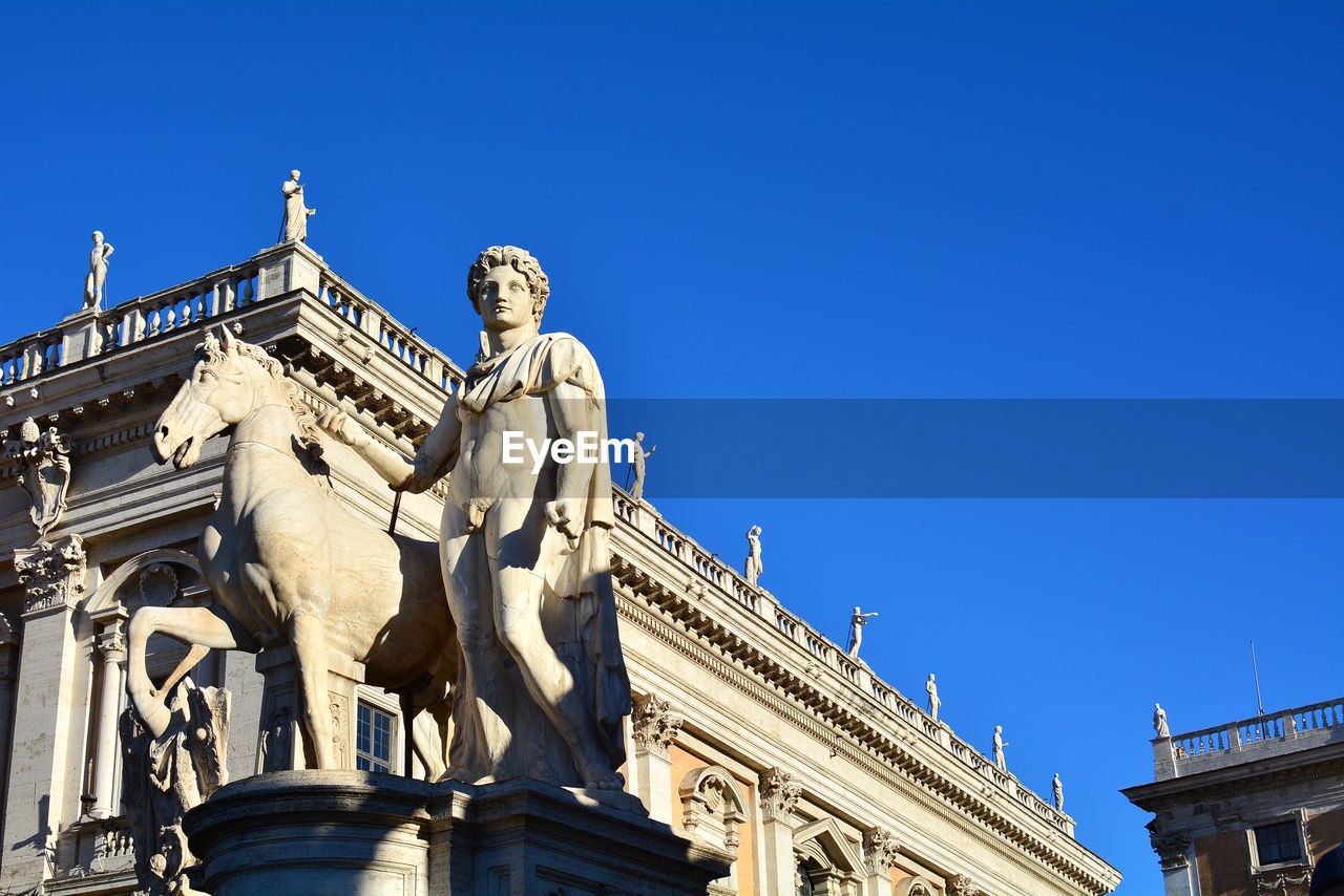 LOW ANGLE VIEW OF STATUE