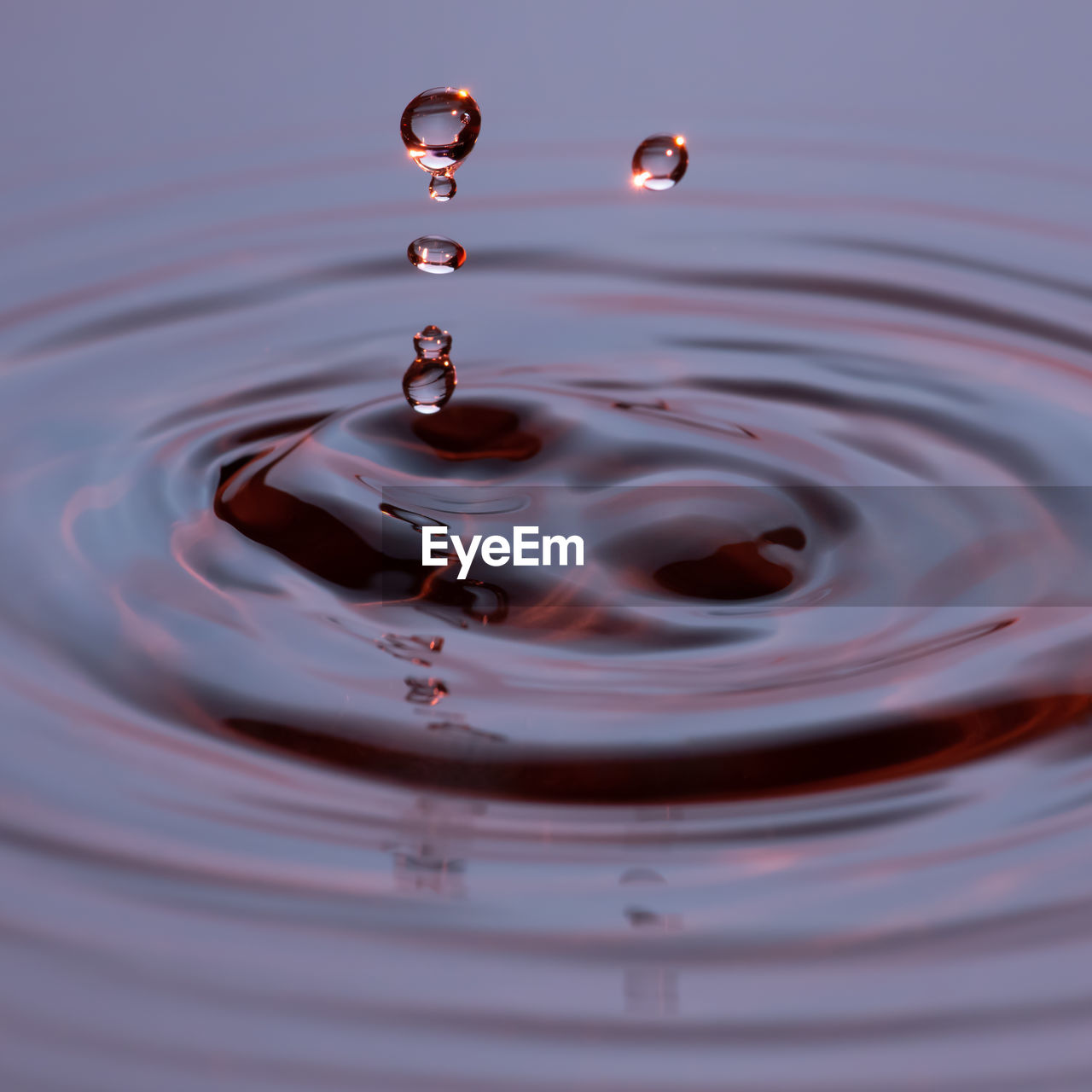 Close-up of drop falling in water