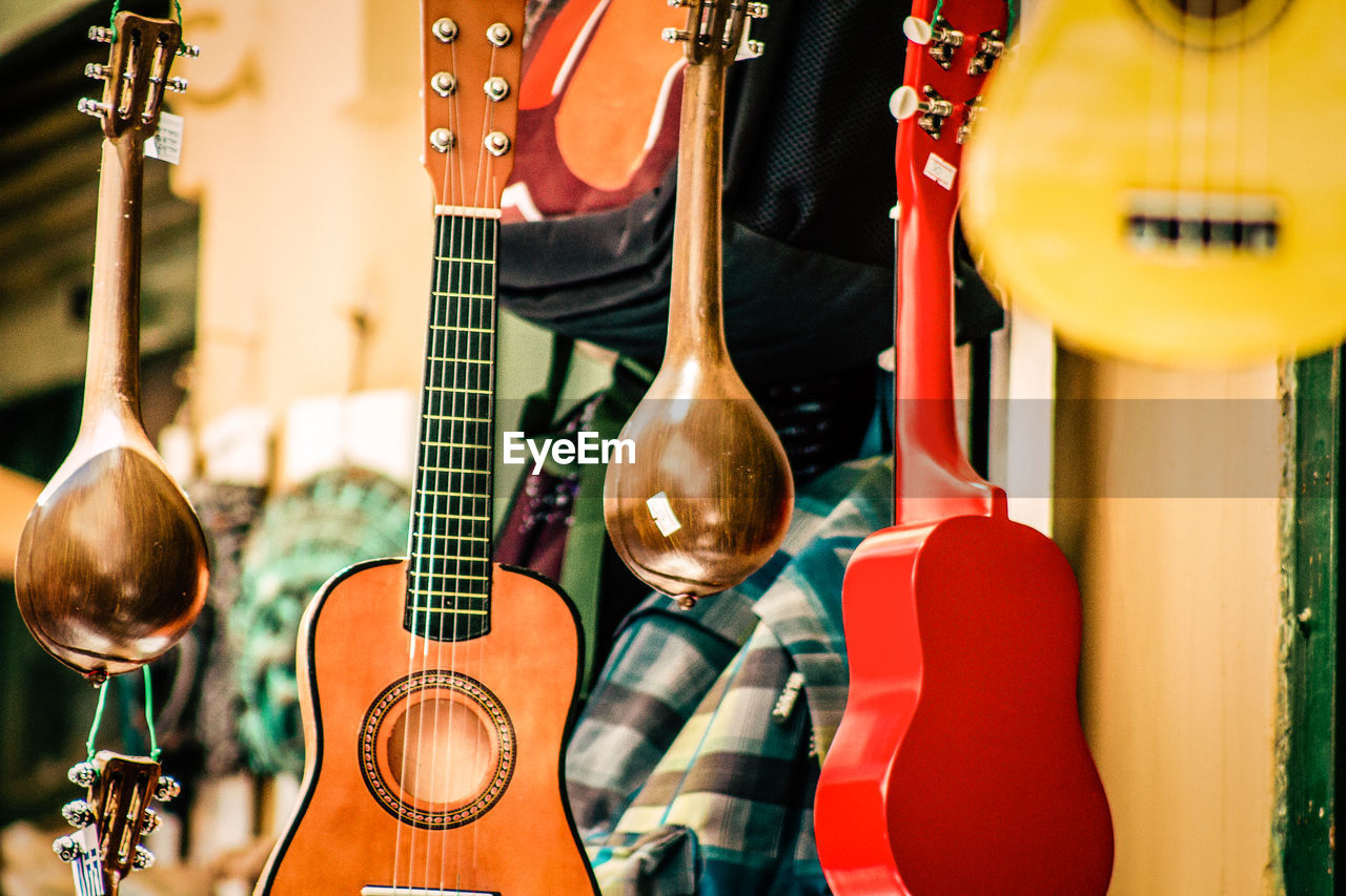 Close-up of guitars for sale