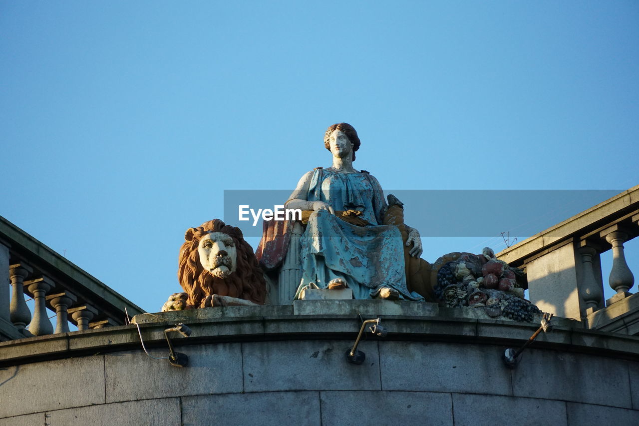 Victorian statues on top of a civic hall