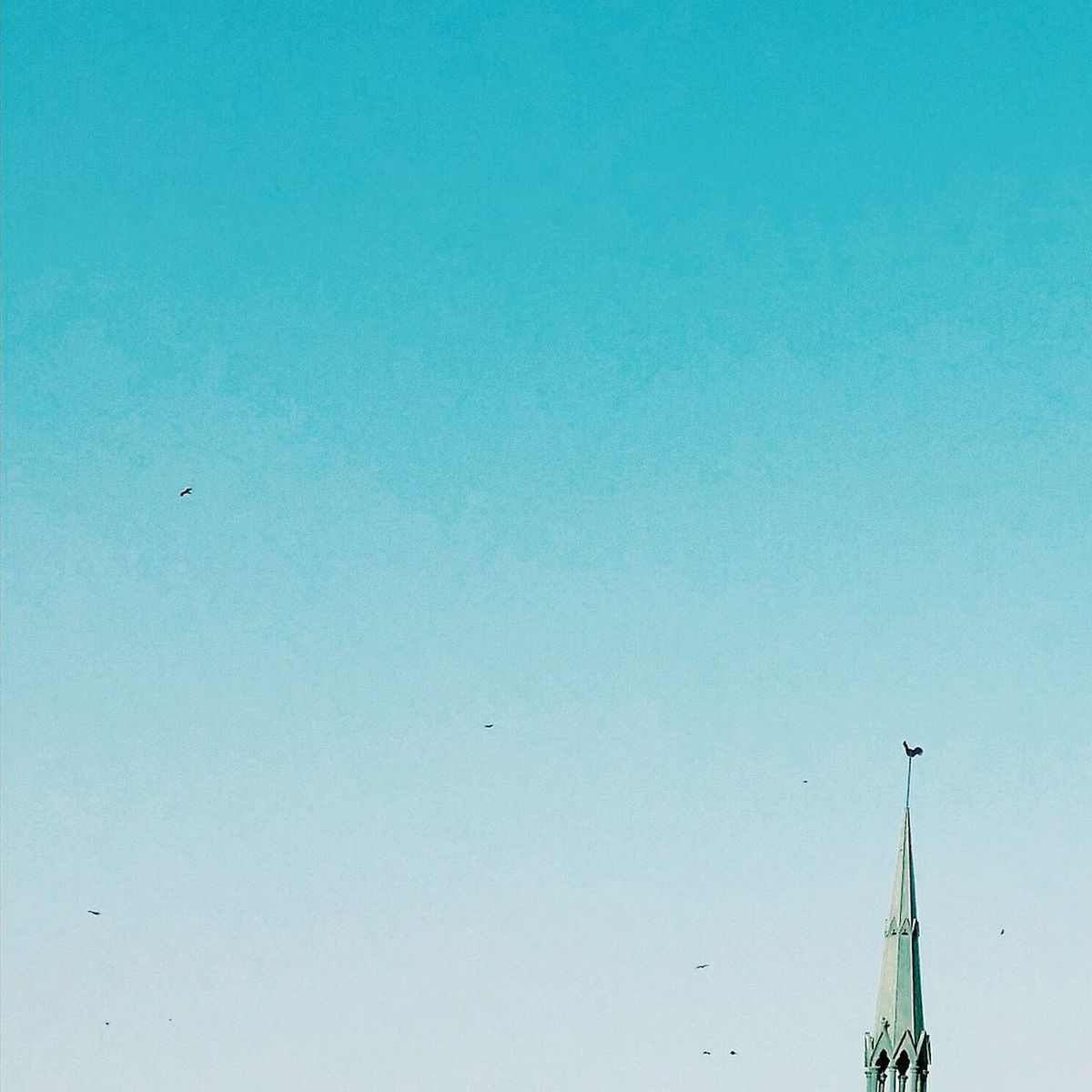 LOW ANGLE VIEW OF TELEPHONE POLE AGAINST BLUE SKY