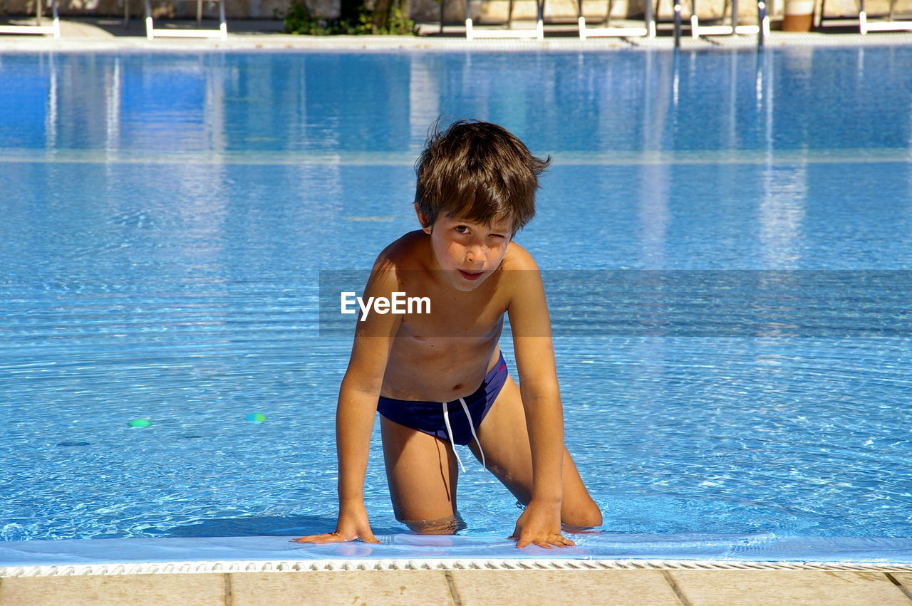 Portrait of happy boy in swimming pool