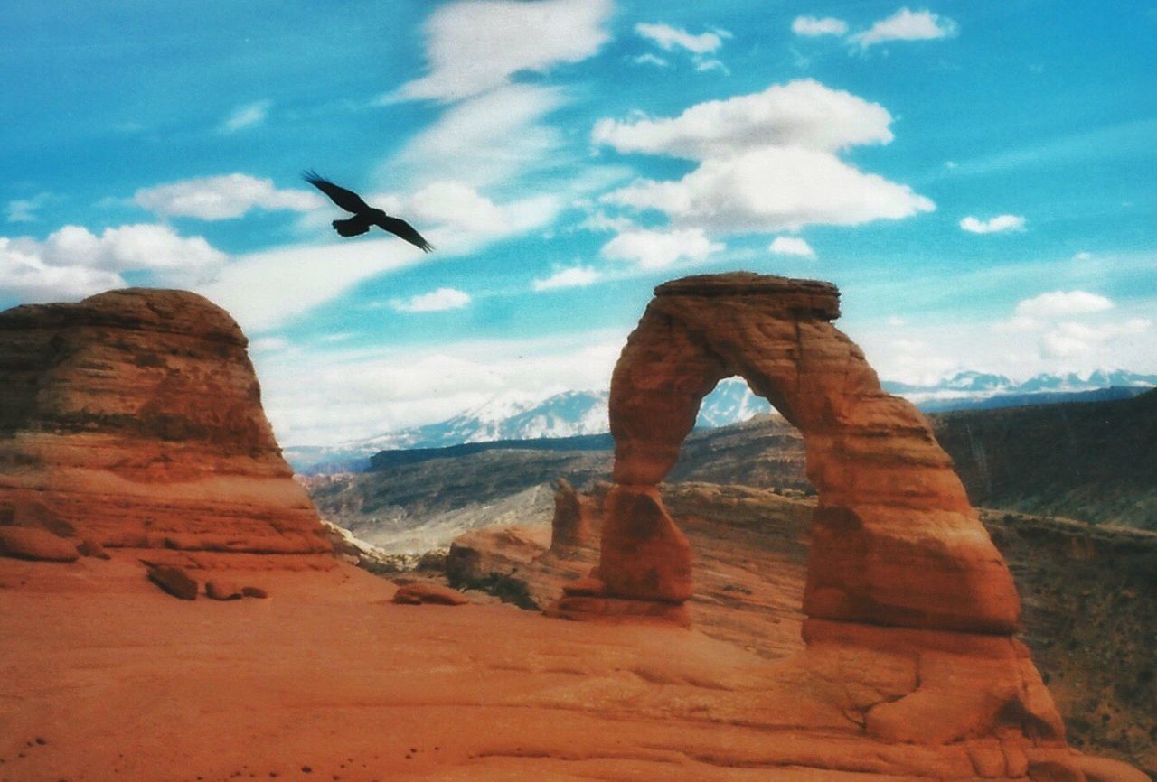 LOW ANGLE VIEW OF ROCKS ON MOUNTAIN AGAINST SKY