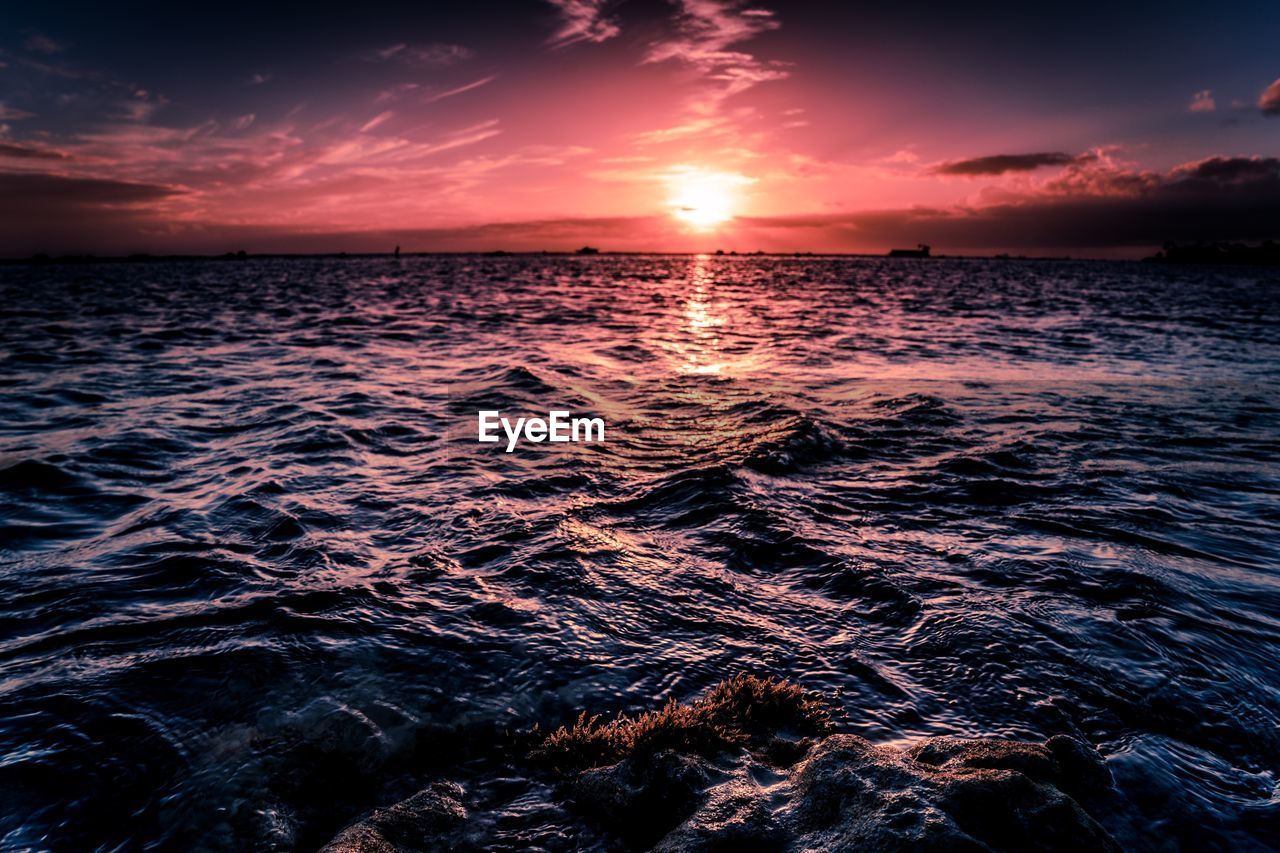 Scenic view of sea against sky during sunset