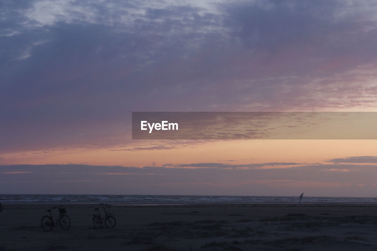 SCENIC VIEW OF BEACH DURING SUNSET