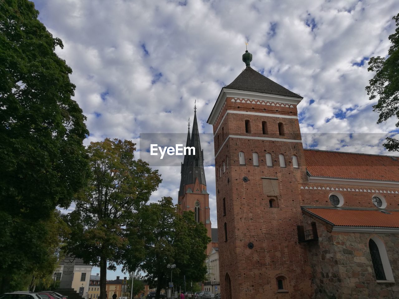 Low angle view of bell tower against sky