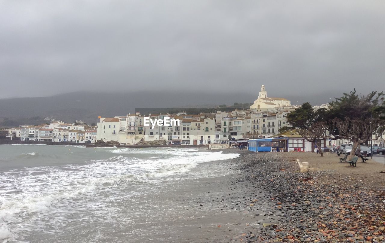 VIEW OF BEACH AGAINST BUILDINGS