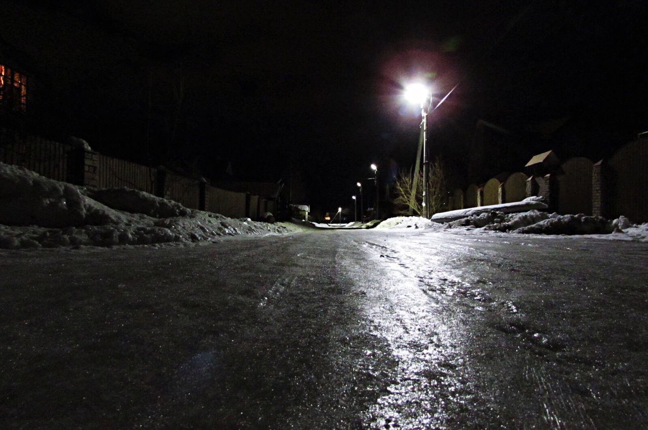 SNOW COVERED ILLUMINATED STREET LIGHTS