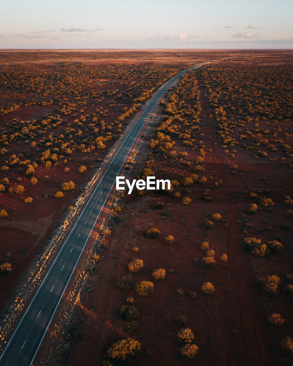 Aerial view of road amidst land