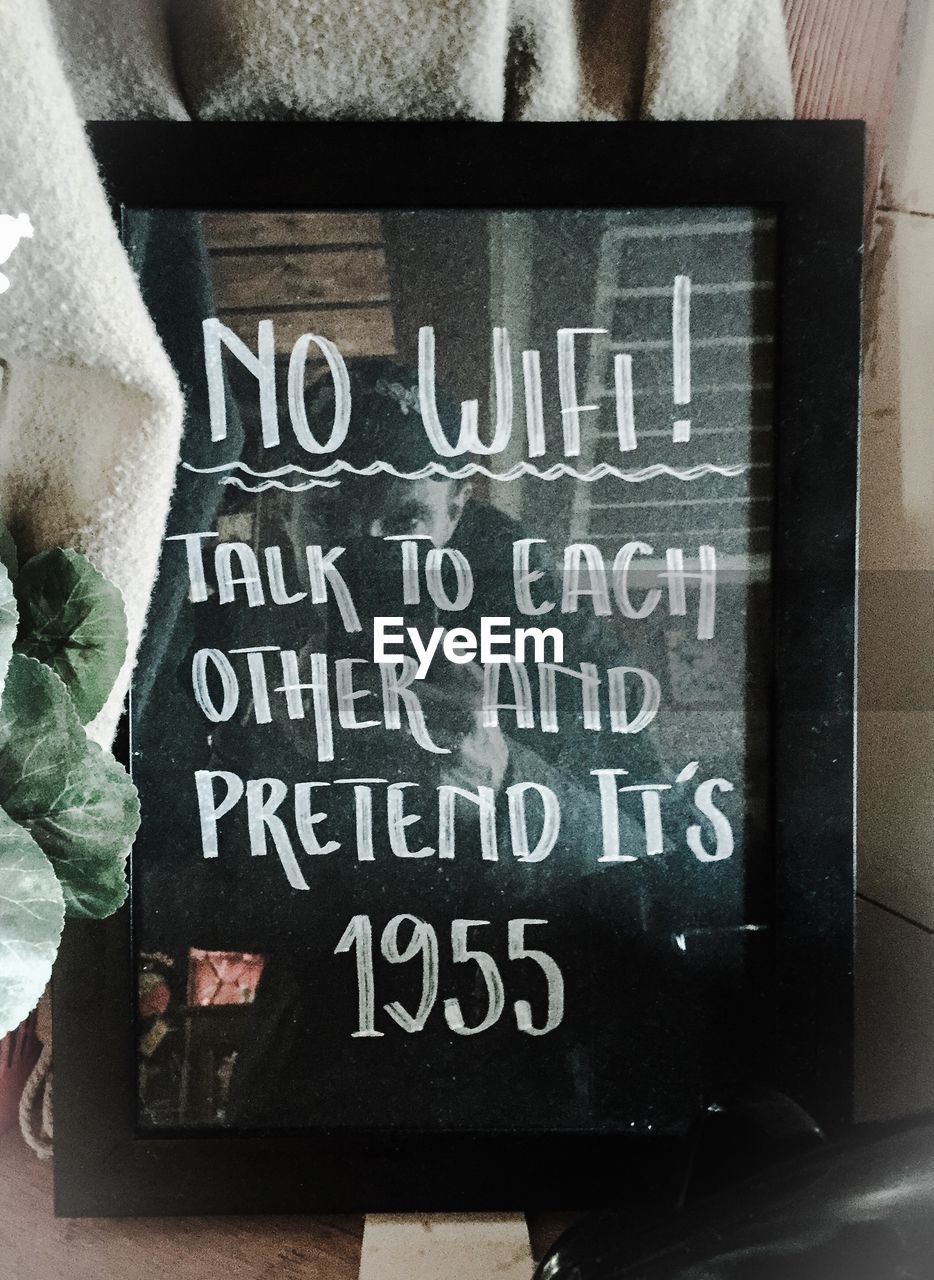 Text message on window display at cafe